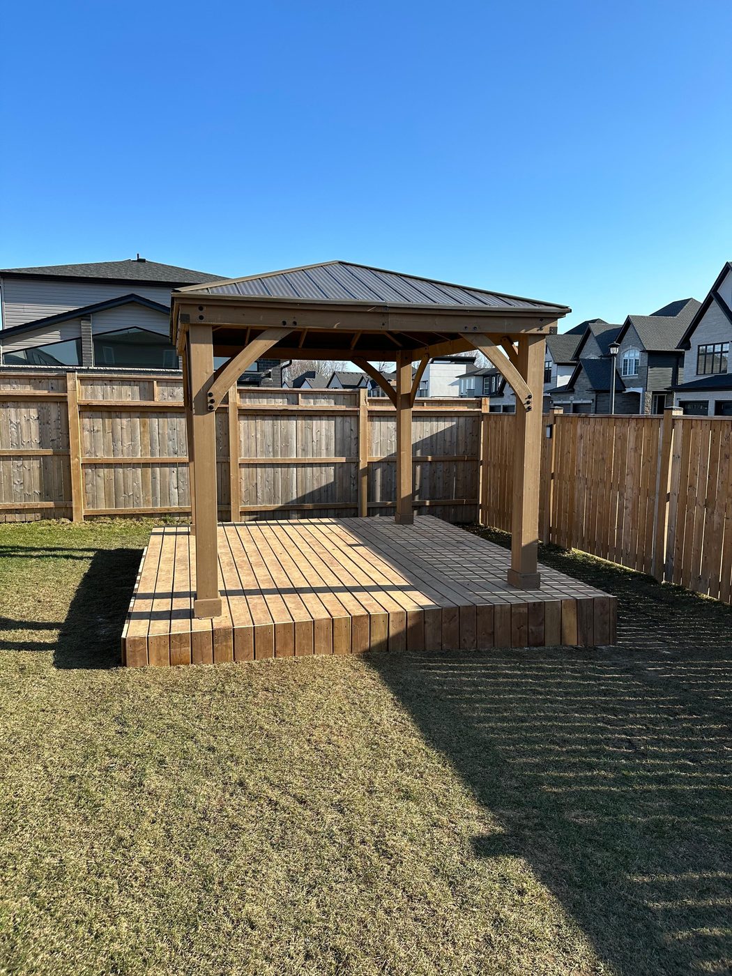 Hardtop gazebo on a built deck